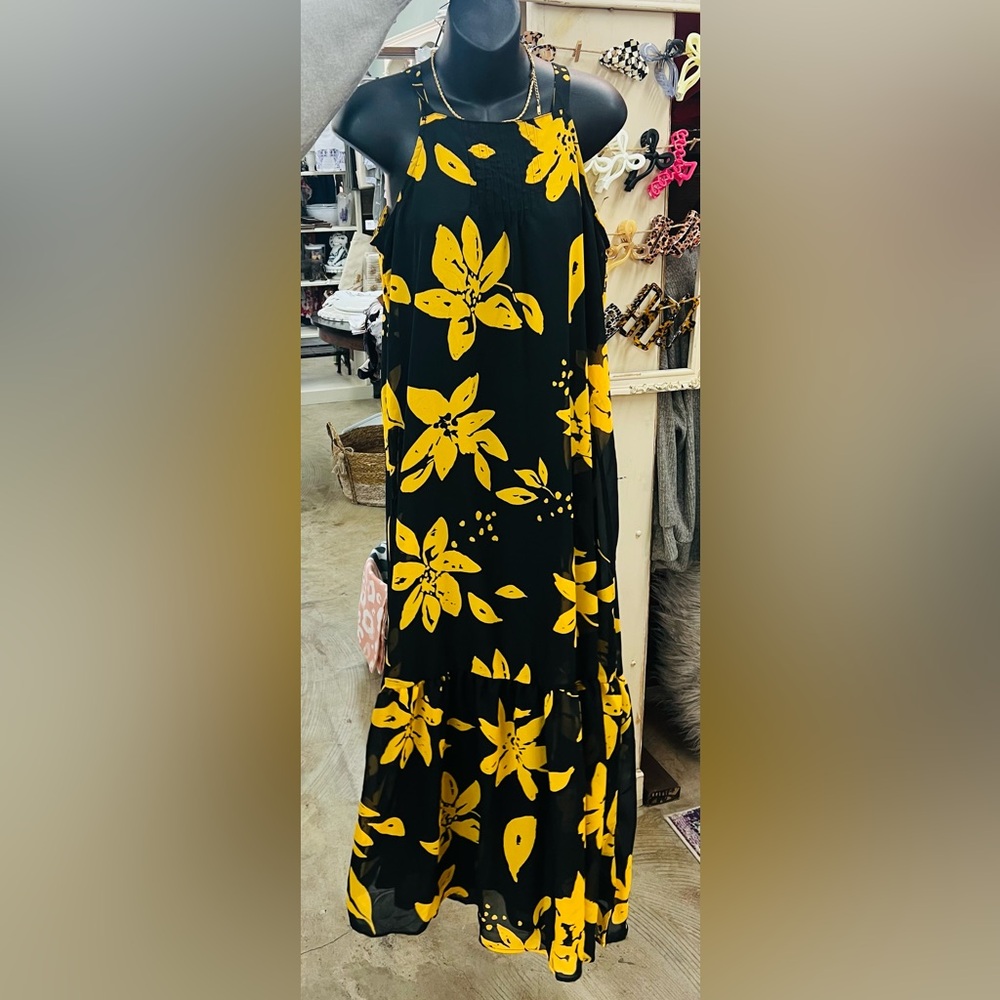 Black and gold Maxi dress. Spaghetti strap with tie in the back around the neck.